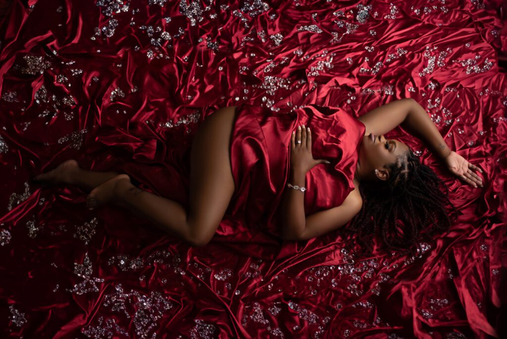 Atlanta boudoir photo with red sheets